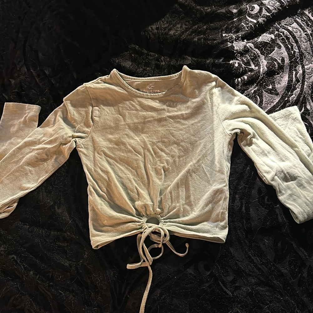 Long sleeve, light green Hollister shirt.